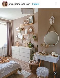 the bedroom is decorated in neutrals and whites, with lots of natural touches to it