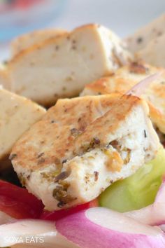 a close up of food on a plate with radishes and bread cubes