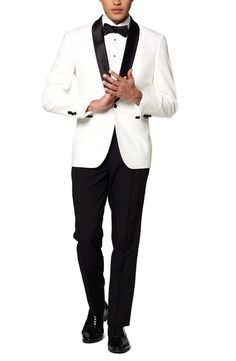 a man in a white tuxedo and black bow tie