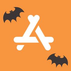 two bats flying next to each other on an orange background with the letter a in the middle