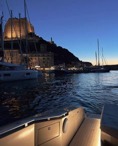 a boat is traveling down the water at dusk