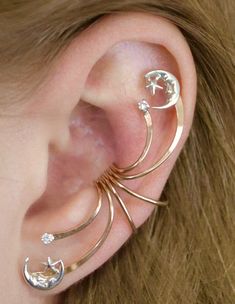 This beautifully spectacular ear cuff is bound to make a statement for you Celestial Jewelry lovers! This Ear Cuff decorates the ear from top to bottom. It hugs the ear in the center of the ear comfortably and securely without piercing and decorates the entire ear. We use only the highest quality materials 14K Gold Filled and Sterling Silver. This item will ship in a Gift Box with easy fitting instructions. Ready for gift giving! Star Ear Cuff, Adjustable Celestial Single Cartilage Earring, Adjustable Celestial Cartilage Earrings, Moon Phases Jewelry, Moon Phase Jewelry, Outfit Planning, Prom Outfit, Ear Crawler, Wrap Earrings