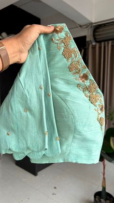 A glamorous cyan blue organza saree featuring a scalloped border is expertly coordinated with a stunning sea green silk handmade blouse having highlighted works for neck as shown. View this post on Instagram A post shared by Handcrafted Sarees by Shobana Nithin (@threadslabel_india) Blue Organza Saree, Blouse Handwork, Green Blouse Designs, Worked Blouse, Ready Made Blouse, Handwork Blouse, Handmade Blouse, Sarees For Girls, Blouse Designer