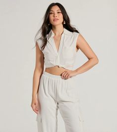 This breezy linen crop top is a sunny day staple! Designed with a lightweight linen-blend fabric, this top is perfect for your summer weekend plans. It features a collared V-neckline with a partial button-down front, a single chest pocket, cap sleeves, a twist-front cropped hem, and a relaxed fit. Style with wide-leg pants and sandals.Fit & FeaturesLinen-blend fabricCollared V-necklineChest pocket, button-down frontCap sleevesSide zipper closureTwist-front cropped hemRelaxed fitRuns true to Trendy White Cropped Shirt For Summer, Versatile Spring Vacation Crop Top, Chic Linen Crop Top For Vacation, Chic White Cropped Shirt For Summer, Chic Cotton Cropped Shirt For Summer, White Cropped Shirt For Summer Day Out, Linen Crop Top For Summer Vacation, Cropped Linen Crop Top For Beach, Versatile Crop Top For Summer Day Out