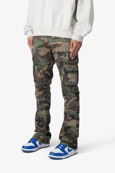 the Bootcut Cargo Pants are designed with our new B fit, which is slim through the thigh and features a slight flare at the leg opening and is constructed from washed camo twill, with a vintage wash and paint splatter, and finished with a contrasting camo panelling. details flare at leg opening 100% cotton model is 6’1 Fitted Camouflage Cargo Pants For Streetwear, Fitted Camouflage Cargo Pants With Straight Leg, Camouflage Straight Leg Cotton Cargo Jeans, Fitted Camouflage Cotton Jeans, Urban Style Cotton Bottoms With Paint Splatter, Urban Cotton Bottoms With Paint Splatter, Urban Style Paint Splatter Cotton Bottoms, Urban Camouflage Straight Leg Cargo Pants, Camouflage Straight Leg Jeans For Streetwear