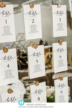 the table numbers are arranged in order to be written on each piece of white paper