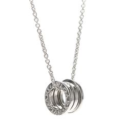 We guarantee this is an authentic BVLGARI 18K White Gold B.Zero1 Pendant Necklace or 100% of your money back. The necklace is crafted of 18 karat white gold and features the iconic B.zero1 barrel motif engraved with the BVLGARI logo on either side.Length: 15 inPendant: 13 mmPendnat Width: 8 mm Item Location: Aventura,Florida Bvlgari Necklace Zero, Luxury Platinum Necklaces As A Gift, Luxury Sterling Silver Jewelry With Shiny Finish, Silver Hallmarked Jewelry For Everyday Luxury, Hallmarked Silver Jewelry For Everyday Luxury, Luxury White Gold Necklace, Luxury Everyday Silver Jewelry, Luxury Silver Necklace With Round Pendant, Luxury Silver Necklace With Shiny Finish