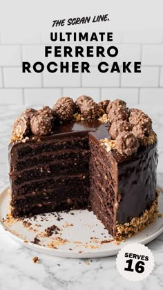 a chocolate cake on a white plate with the words ultimate ferero rocher cake