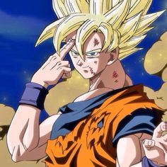 the young gohan is holding his hand up to his ear and pointing at something