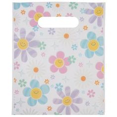 a white bag with flowers and smiley faces on it