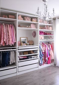 a woman sitting on a chair in front of a closet