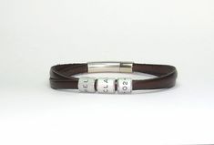 "Custom engraved leather bracelet for men. A gift for father. Personalized leather bracelet with rings. this personalized bracelet is a perfect gift for father, brother, boyfriend. This bracelet is a perfect gift for a man. The bracelet will remind him every day that you love him. This engraved bracelet reminds you of people and dates that are important to you. It can make him smile and be happy. P E R S O N A L I Z E Engraving is done by hand, it is deep and has a permanent color. You can write Engraved Leather Bracelets, Leather Bracelet For Men, Personalized Leather Bracelet, Gift For Father, Personalized Bracelet, Men's Bracelet, Engraved Bracelet, Bracelet For Men, One Ring