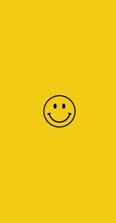 a yellow background with a smiley face drawn on it