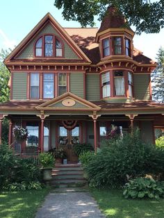 an old victorian style house with many windows