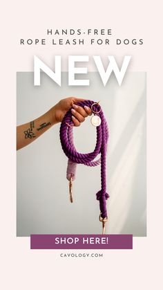 a hand holding a purple rope with the words new shop here