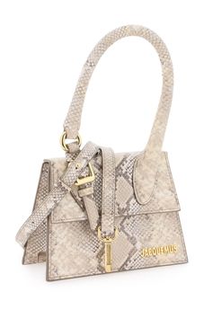 Le Chiquito moyen boucle handbag by Jacquemus, crafted in snake-print leather with metal logo lettering detail applied on the front. Enhanced by the handle with gold metal domed buckle and ring detail. It features flap closure with magnetic button, removable and adjustable leather shoulder strap, fabric-lined interior with a card pocket. Gold-finished metal hardware. Jacquemus Le Chiquito Long, Jacquemus Le Chiquito Moyen, Le Chiquito Long, Cercei Din Lut Polimeric, Le Chiquito Moyen, Jacquemus Le Chiquito, Printed Leather Bag, Long Snake, Python Bags