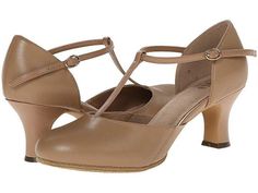 a pair of women's tan shoes with straps