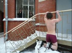 Here’s a guy in red shorts hanging onto a balcony with a gun pointed at him. Memes