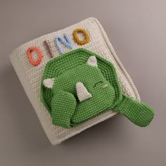 a crocheted book with an elephant on it's cover that says no one