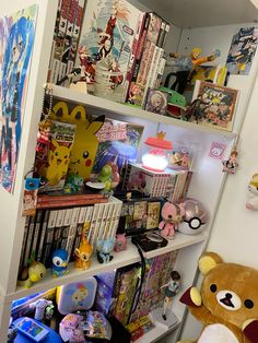 the shelves in this room are filled with various toys and games, such as pokemon pikachu