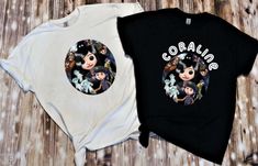 two black and white shirts with cartoon characters on the front, one has an image of three witches