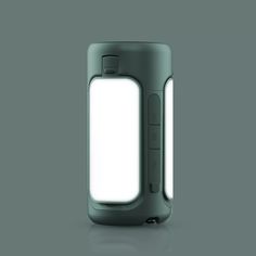 an electronic device with a white light on the top and back side, in front of a gray background