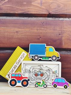 three wooden magnets with cars and trucks on them