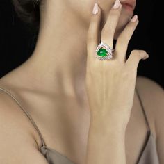 For Sale on 1stDibs - This one is a special one, it is from a very special collection of very special lady. 10.90 Ct's Cabochon Emerald Cocktail Ring Heart Shaped Diamond Ring