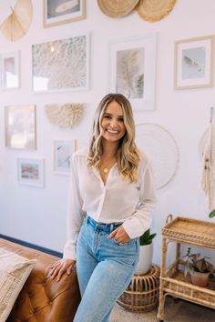 a woman posing for the camera in her living room