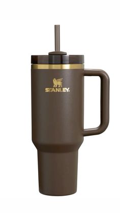 the stanley travel mug is brown and gold