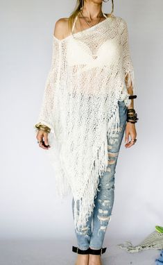 White knit poncho; hand knitted long and baggy to get the perfect boho look. The see-through knit tunic can be used as a beach cover-up top or also can be used as a summer shawl when you feel a slight chill in Spring/Summer evenings. The white dress cover-up top is made with cotton blended soft yarn. Here is the same poncho cover-up made with a slightly sequined boucle that gives the perfectly sparkled texture to the poncho; https://www.etsy.com/listing/616783823/beach-cover-up-poncho-boho-weddi Knit Capelet, Loose Knit Jumper, Knitted Capelet, White Poncho, Sequin Knit, Boho Poncho, Womens Knitwear, Summer Shawl, Bridal Cover Up