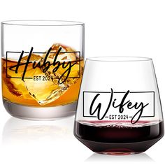 two wine glasses sitting next to each other on top of a white surface with the words,