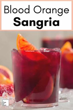 blood orange sangria in a glass garnished with an orange slice