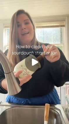 a woman pouring something into a sink with the words how to clean your sourdouch starter jar