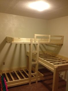 a bunk bed with two sets of ladders on the bottom and one set above it