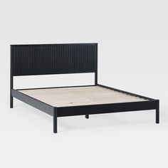 a black bed frame with wooden slats