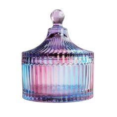 a colorful glass jar with a lid on it's side and a white background