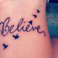 the word believe written in cursive writing on a woman's ankle