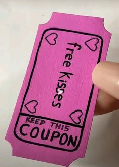 someone is holding up a pink coupon card with hearts on it and the words free hugs keep this coupon