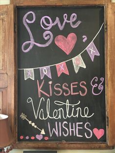 a chalkboard sign that says love kisses and valentine wishes