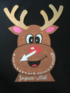 a wooden cut out of a reindeer's head with the words joywux noel written on it