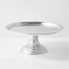 a silver plate sitting on top of a white counter