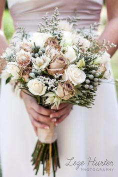 a woman holding a bouquet of flowers on her wedding day, with the caption's tweet below it