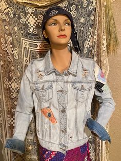 Upcycled repurposed boho hippie denim jacket with embellished handmade vintage fabric patches and mushroom patch on several different places on the jacket including one sleeve. Tag size woman's medium. Please look at the pictures for specific measurements. This jacket is one-of-a-kind jean jacket with handmade vintage fabric patches that make it very unique. This is a great purchase for anyone looking to standout at a music festival, school, coffee shop, etc. Repurposed and vintage materials mak Hippie Patchwork Cotton Denim Jacket, Hippie Cotton Patchwork Denim Jacket, Hippie Cotton Denim Jacket For Fall, Hippie Patchwork Denim Jacket For Fall, Bohemian Winter Denim Jacket With Patchwork, Fitted Bohemian Denim Outerwear, Bohemian Fitted Denim Jacket For Fall, Festival Denim Patchwork Outerwear, Bohemian Patchwork Denim Jacket For Winter