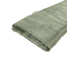 a roll of green fabric on a white background