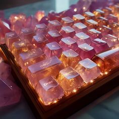 a close up of a keyboard with lights on it