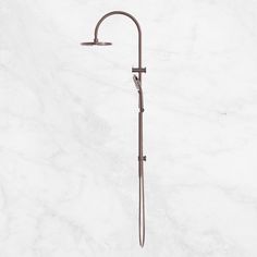 an old fashioned shower faucet on a marble background