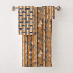 an orange and blue curtain hanging on the side of a wall