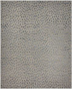 an animal print rug is shown in grey