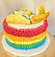 there is a cake that looks like a rainbow taco